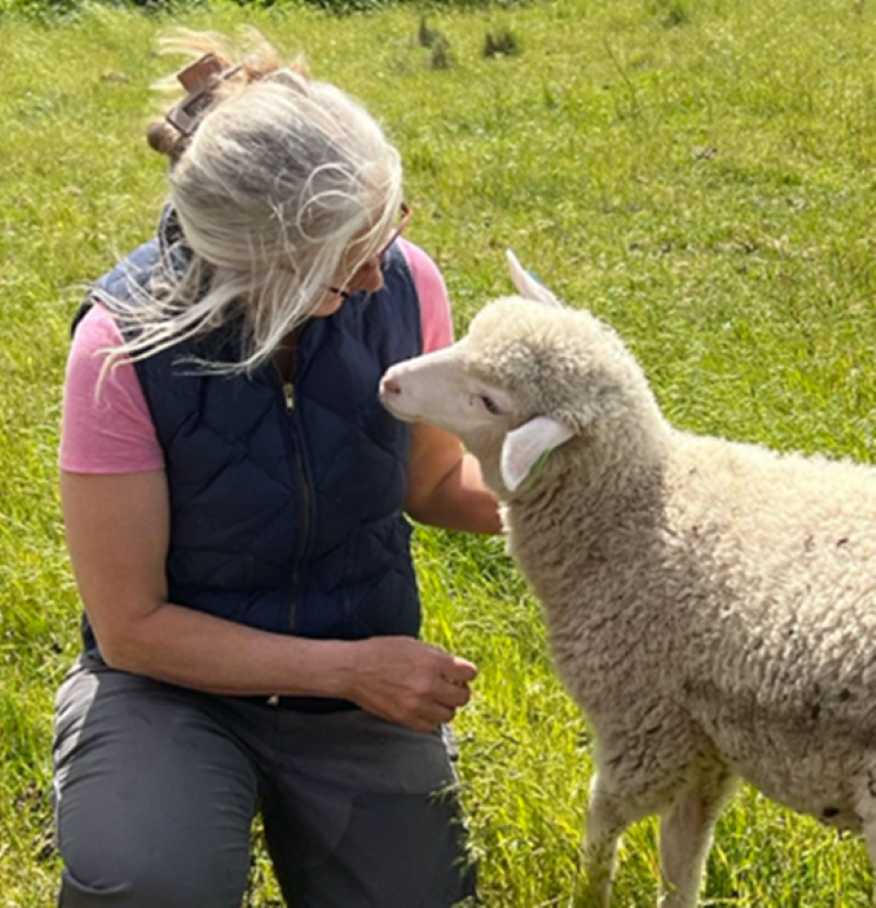 Photo of woman farmer and one of her sheep